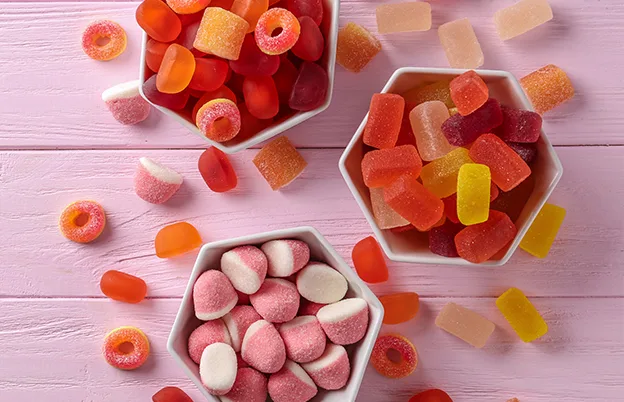 orange pink red and yellow gummies