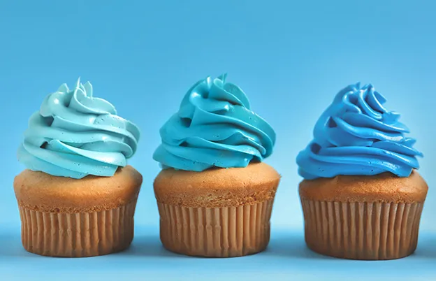 blue shades of frosting on cupcakes